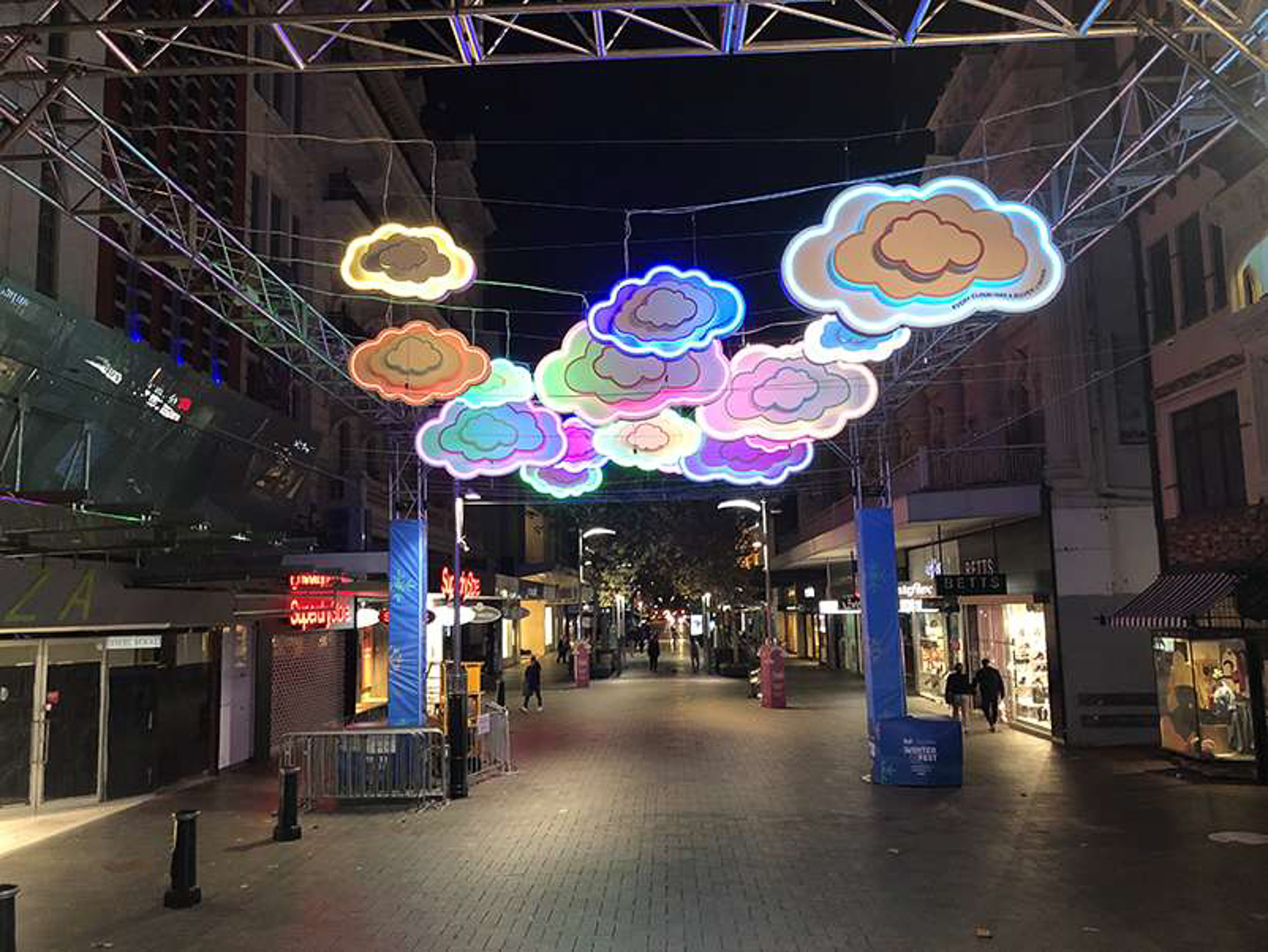 Colourful illuminated neon cloud signage installation for outdoor public space in Perth